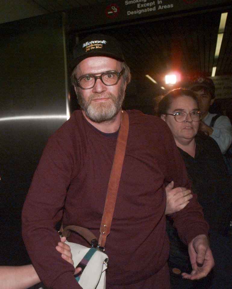 Leann Lewis and her father leaving a federal corrections center after her release on bond.