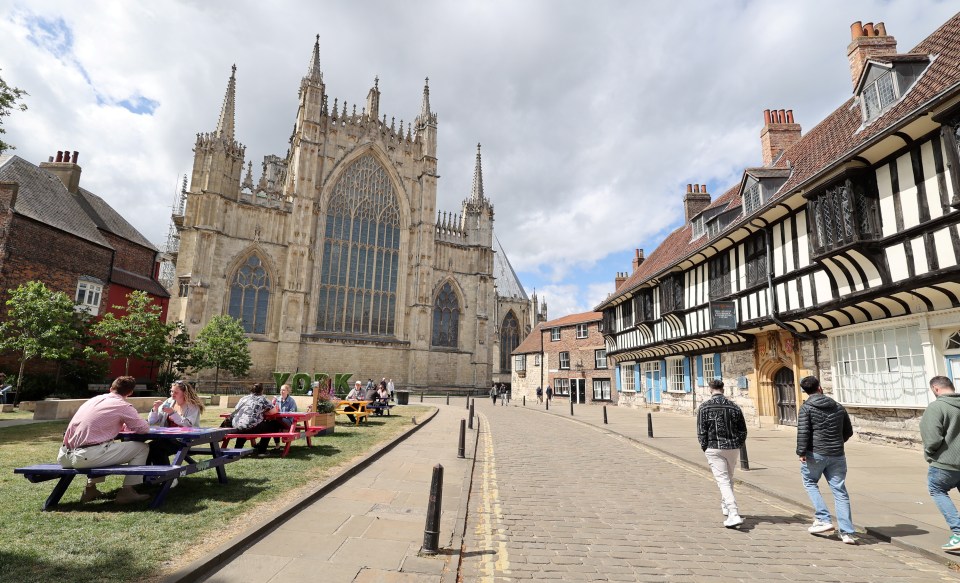 York Minster and street scene with tourists.