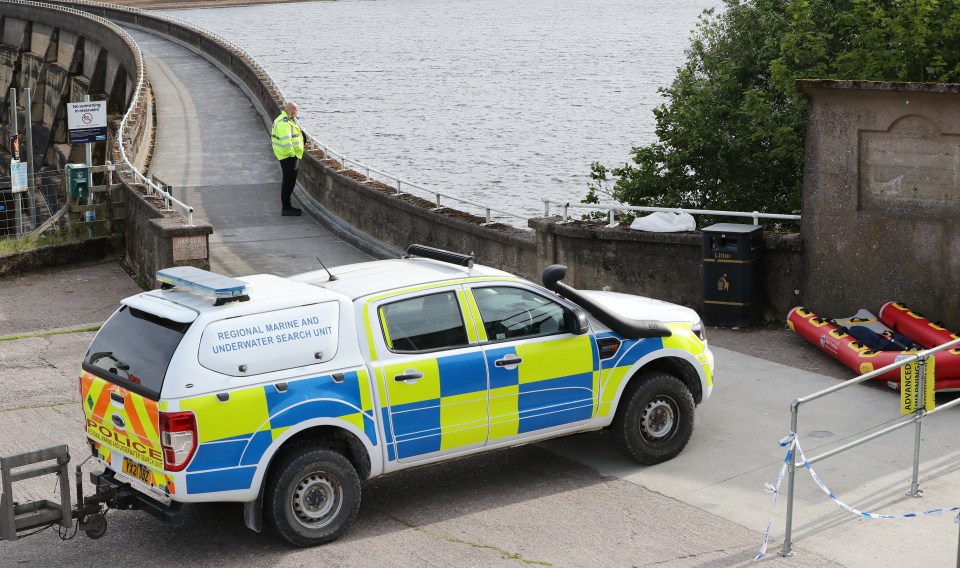 Police underwater search team at a reservoir.