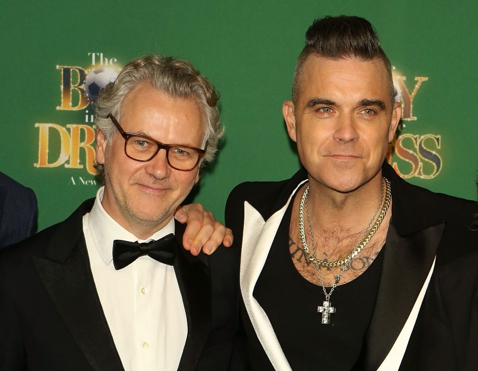 Guy Chambers and Robbie Williams at a press night.