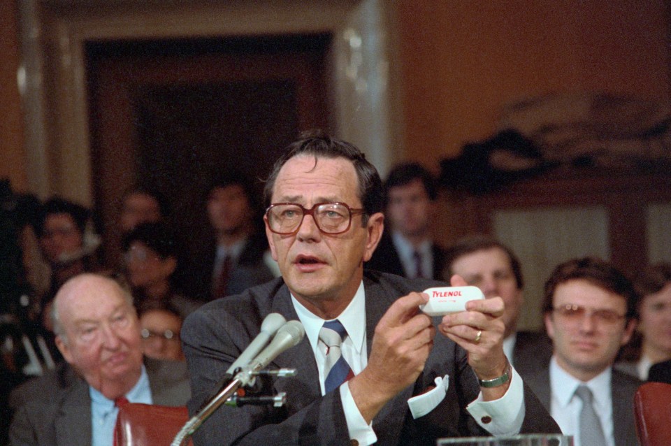 David Clare, Johnson & Johnson president, holding Tylenol bottle at Senate hearing.