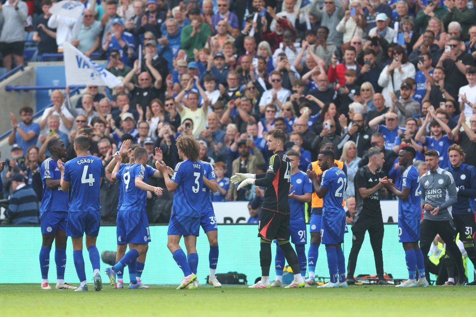 Leicester City players receive a guard of honor.
