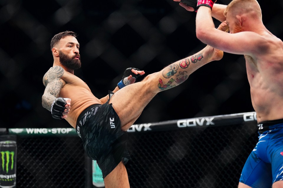 Paul Craig of Scotland kicking Bo Nickal during a UFC middleweight fight.