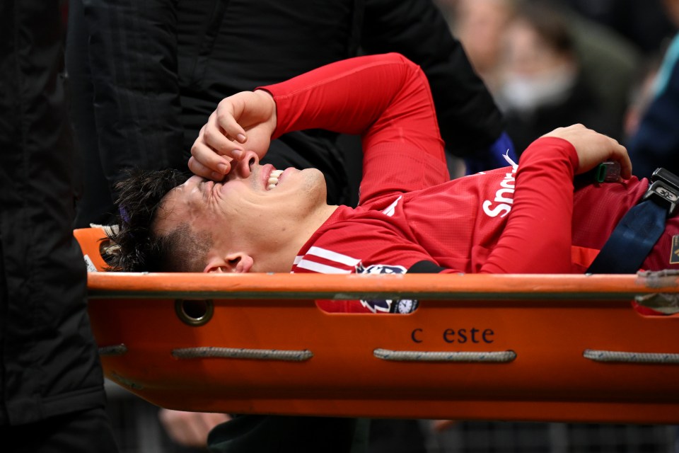 Lisandro Martinez of Manchester United being stretchered off the pitch after an injury.
