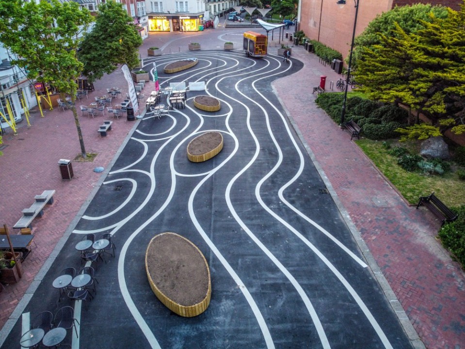 A newly pedestrianised zone has been branded a waste of money with a silly design at a huge cost to the taxpayer along Montague Place in Worthing, West Sussex. Wiggly white lines were added to the new tarmac surface which has cost £178,000 as part of an improvement scheme, of which £23,500 was spent on design and management fees and £1,230 on the painting of the swirly white lines. The Worthing Society Committee were dismayed to see the appearance of the swirly white lines and urged the council to remove the harsh, intrusive white lines as soon as practically possible. Writing on Facebook Sue Belton Worthing Society Chair added, This area is part of the historic South Street Conservation Area and should showcase the town linking Montague Street to the seafront promenade. In our opinion these extensive white lines are over-dominant. They detract from the historic character of the listed buildings Previously the road was used as parking for the disabled for a very short walk to the shops. Now tarmacked, the area has allowed cafes and restaurants to have more outdoor seating, along with new wooden planters which are yet to have flowers and shrubs planted. People took to Facebook to give their views, Tamara Murray wrote Huge shame, waste of money and silly design. By taking away the safe disabled parking there it will take away business from Worthing. Andrea Bristow added, It looks like a kid has been let loose with a white line machine! What an absolute mess. Looks tacky and a terrible waste of money wrote another mystified resident. Roy Hammond saw the funny side writing, I think this is very thoughtful of the council. Its an effort towards all the drunks in Worthing to make them think they are walking in straight lines. Following a freedom of information request to Adur & Worthing Council, they responded with the costings, The pedestrianisation of Montague Place has cost £178,000, of which £23,500 was full technical scheme design and management fees. This was fully funded by the high street grants provided by the government to the Borough Council in response to the re-opening of the high street following the lifting of restrictions. The costs of the decorative white lining were £1,230, which included the cost of material and installation. These costs are included in the overall cost envelope above. Please credit: Paul Jacobs/pictureexclusive.com Standard reproduction rates apply, contact Paul Jacobs, Picture Exclusive to arrange payment - 07923 866166, pictureexclusive@gmail.com
