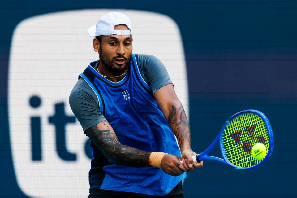 Nick Kyrgios of Australia hitting a backhand in a tennis match.