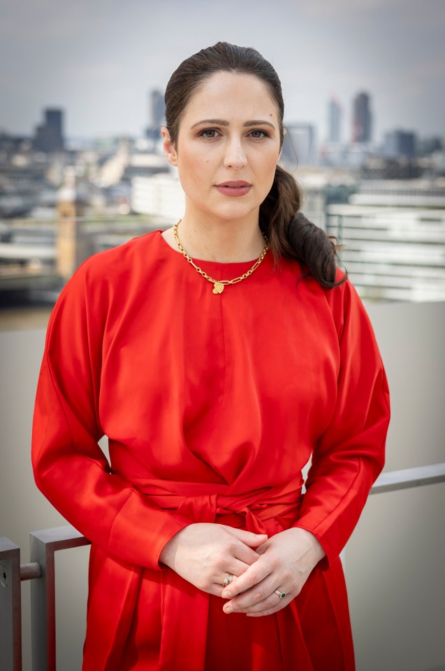 Nicola Thorp in a red dress.