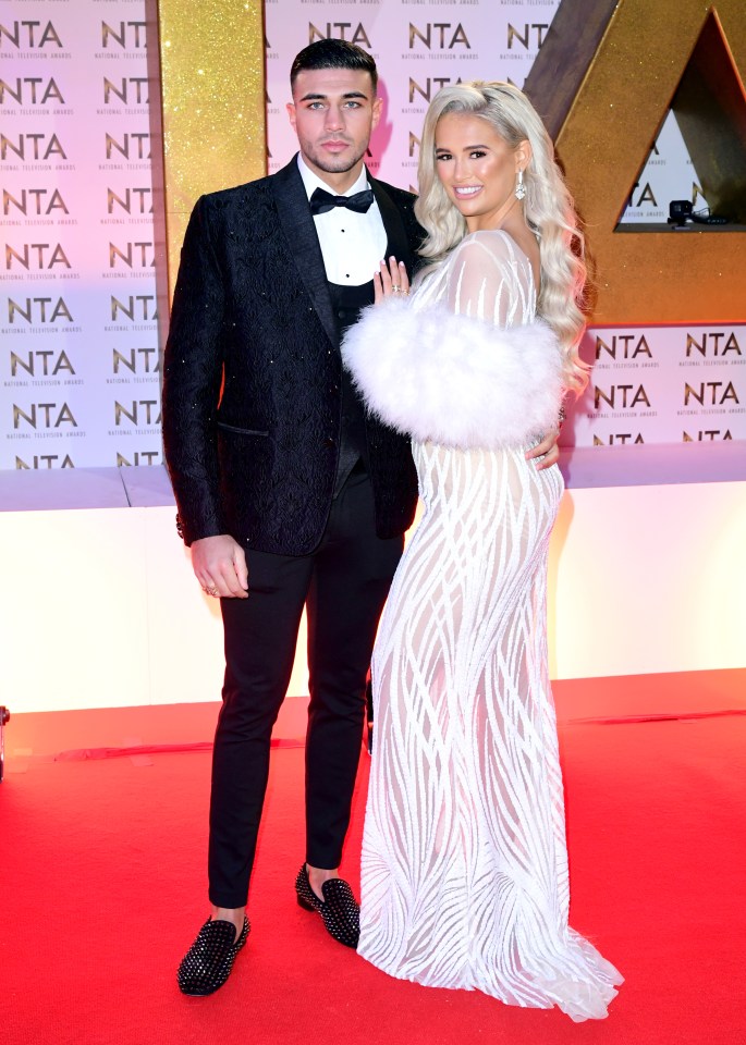 Molly Mae and Tommy Fury on a red carpet.