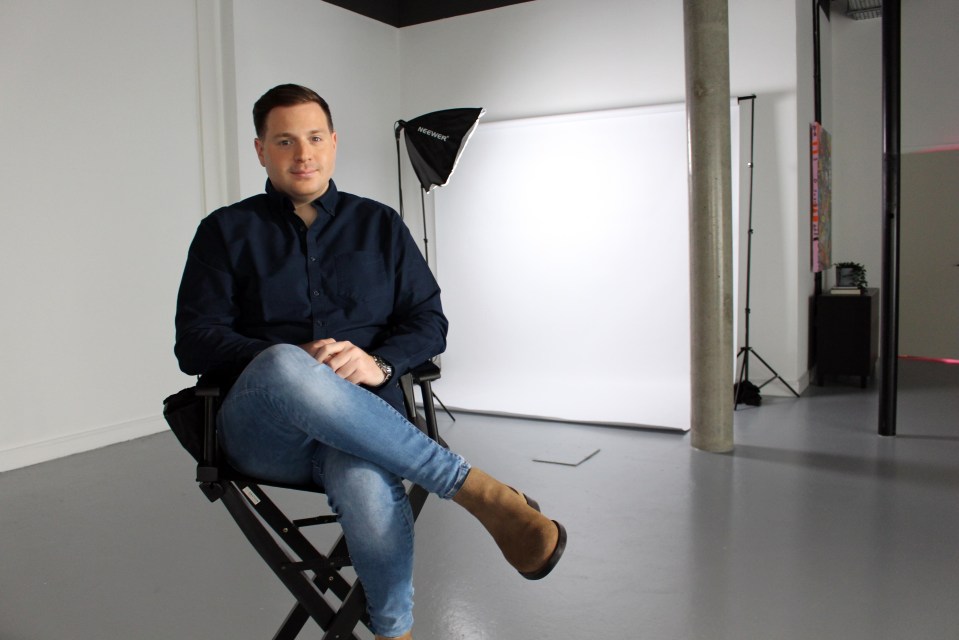 Journalist Josh Rom sitting for an interview.