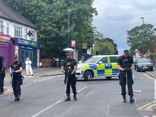 Police officers investigating a shooting.