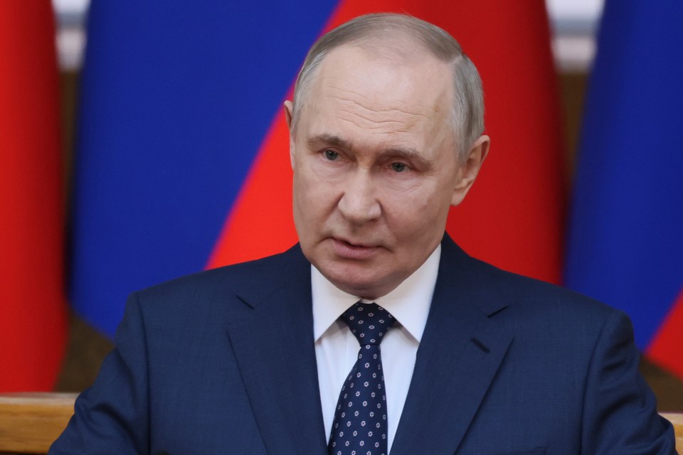 Vladimir Putin speaking at a meeting.