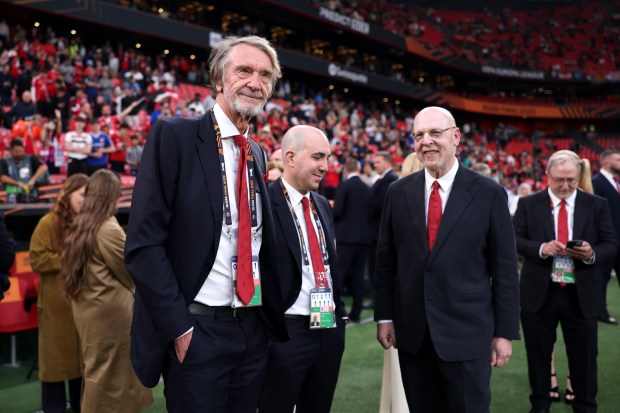 Sir Jim Ratcliffe and Avram Glazer at a soccer match.
