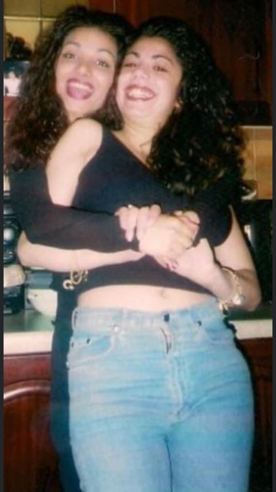 Ayse Hussein and Jan Mustafa embracing.