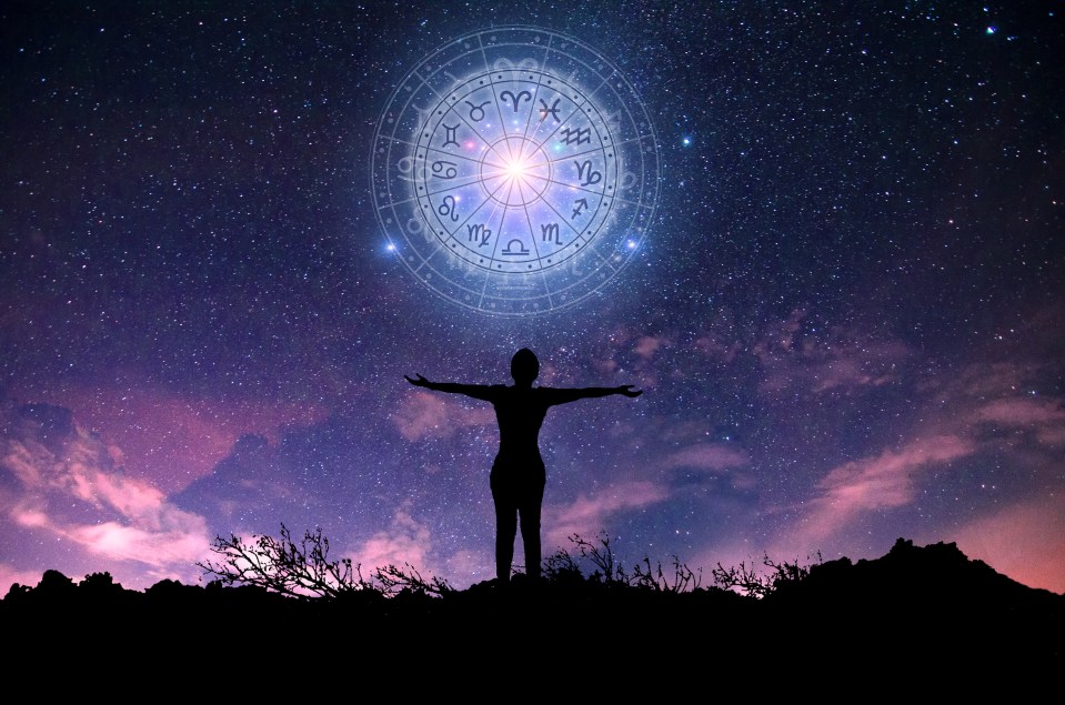 Silhouette of a person with arms outstretched under a night sky showing the zodiac wheel.