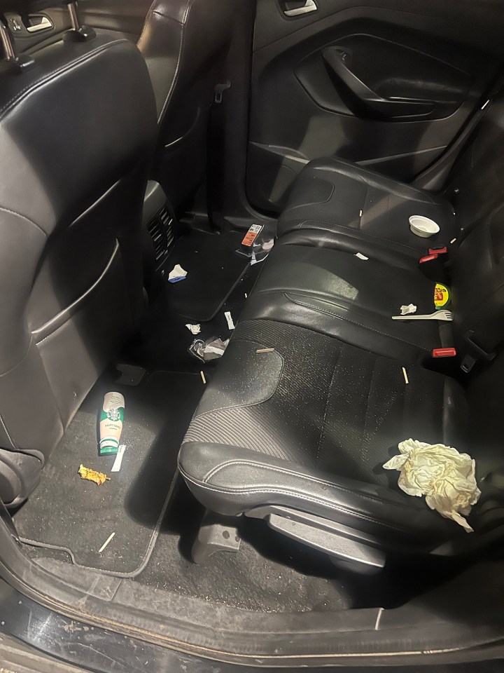 Messy car interior after a taxi ride.