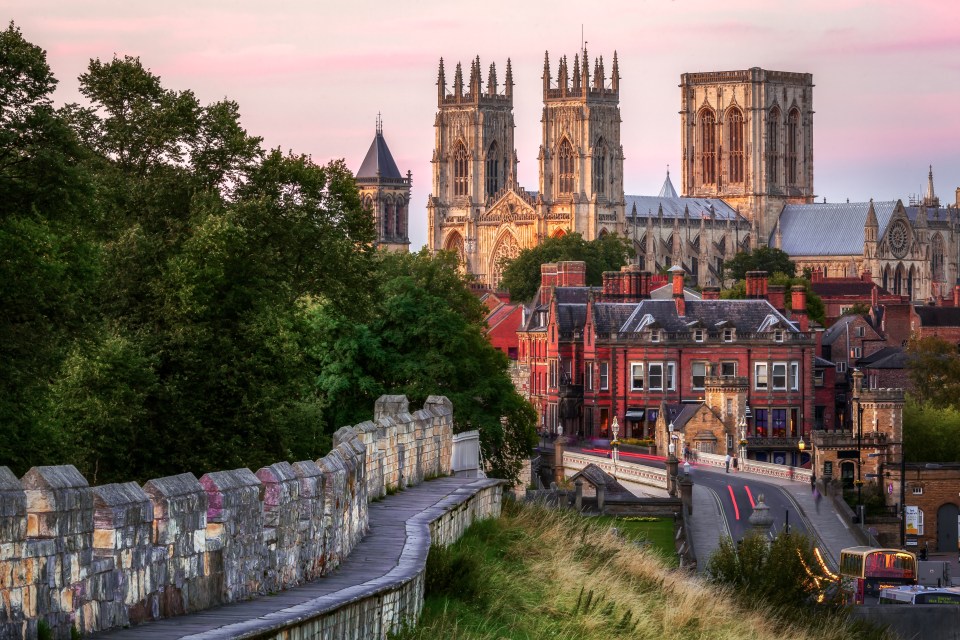 York Minster and city walls at sunset.