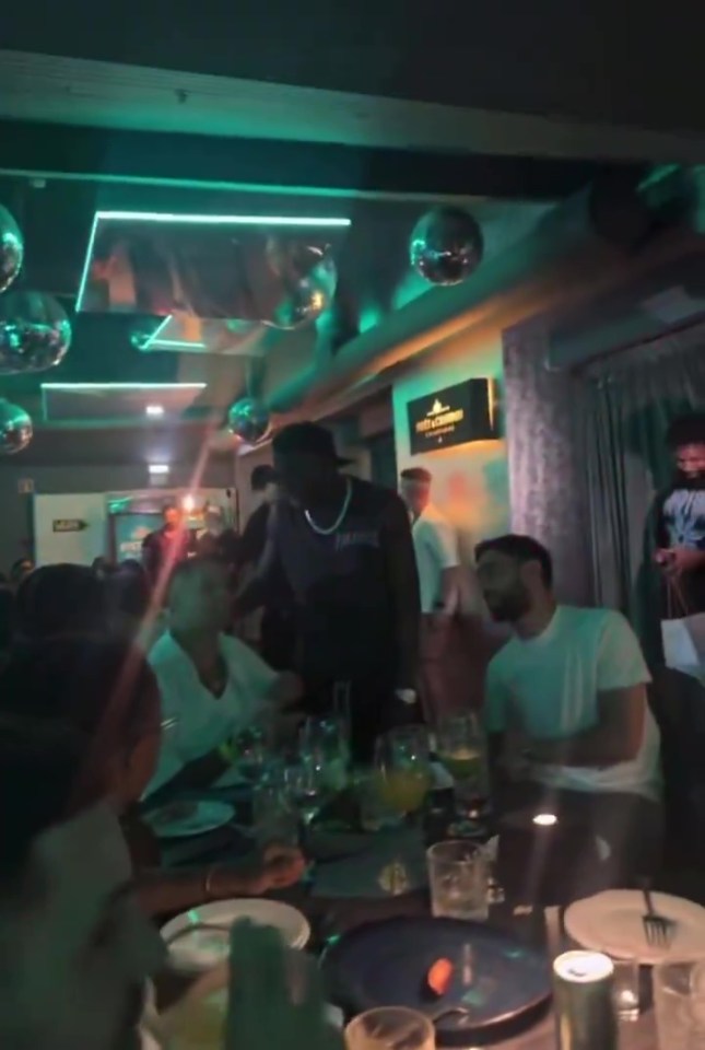 Bruno Fernandes and Joao Cancelo at a restaurant.